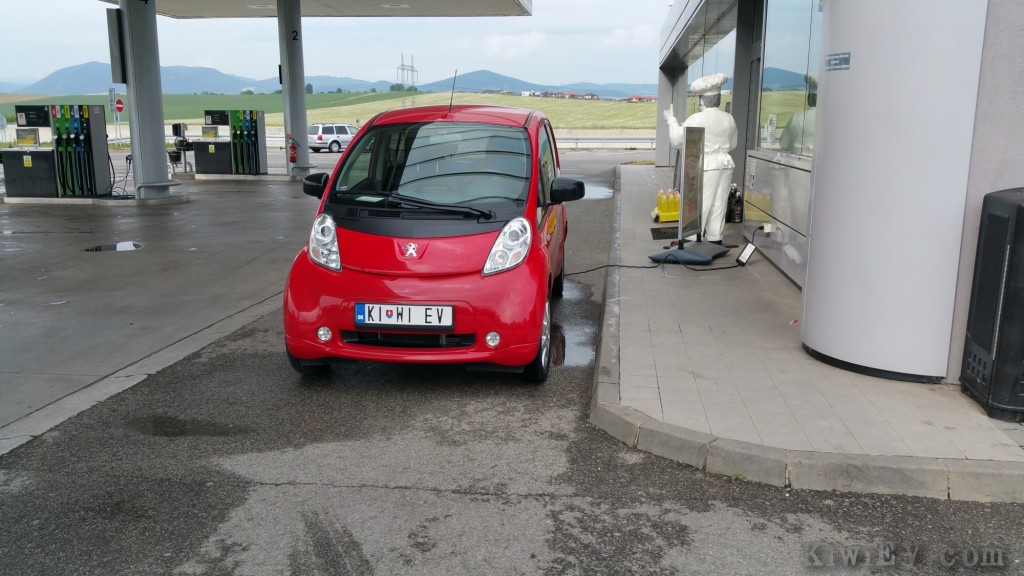 electric car at a gas station