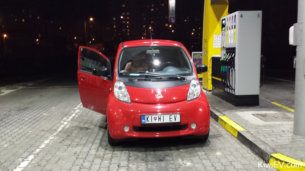 an electric car buying gas