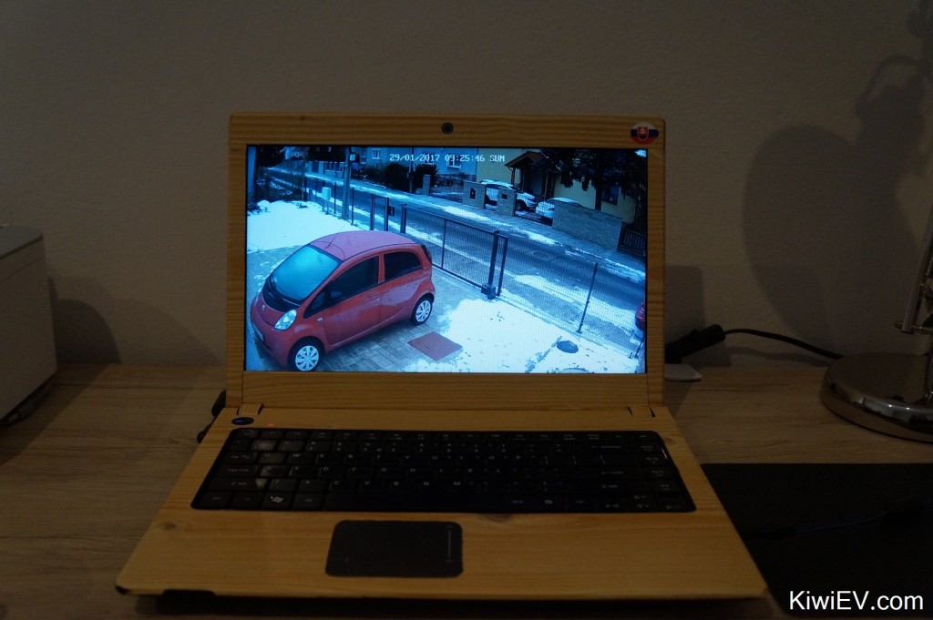 Watching the car on the security camera.