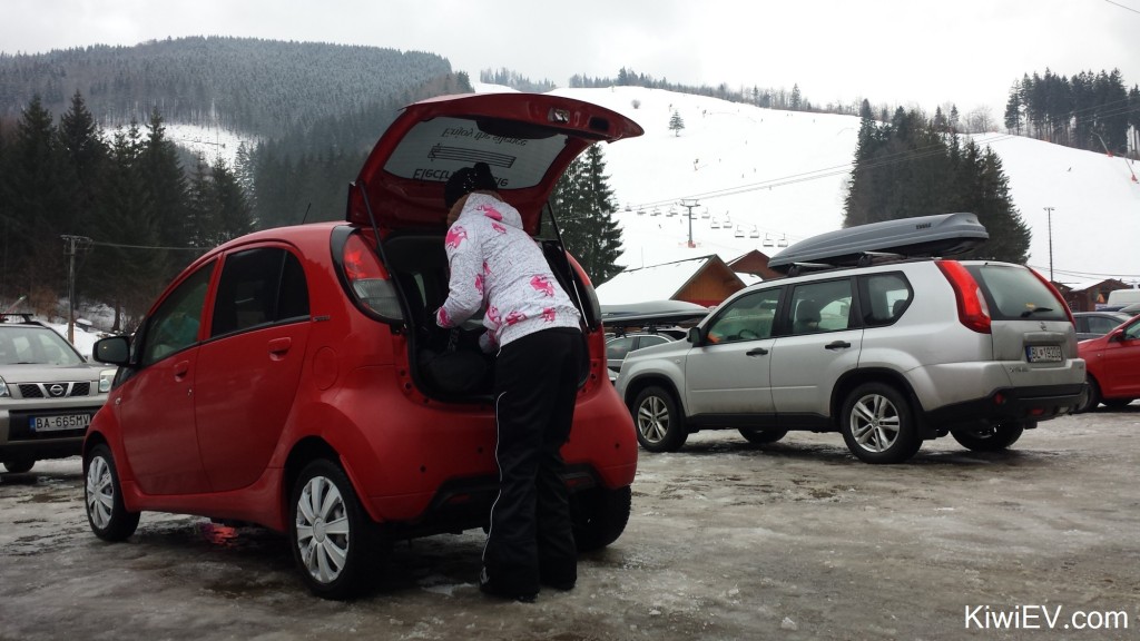 Taking the electric car skiing in the mountains